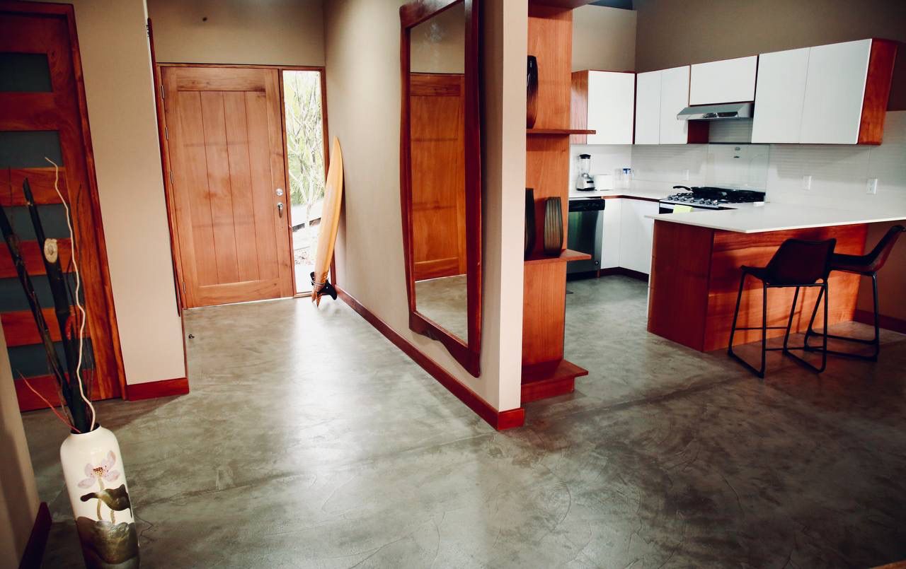Grand entrance with hardwood door and polished concrete floors