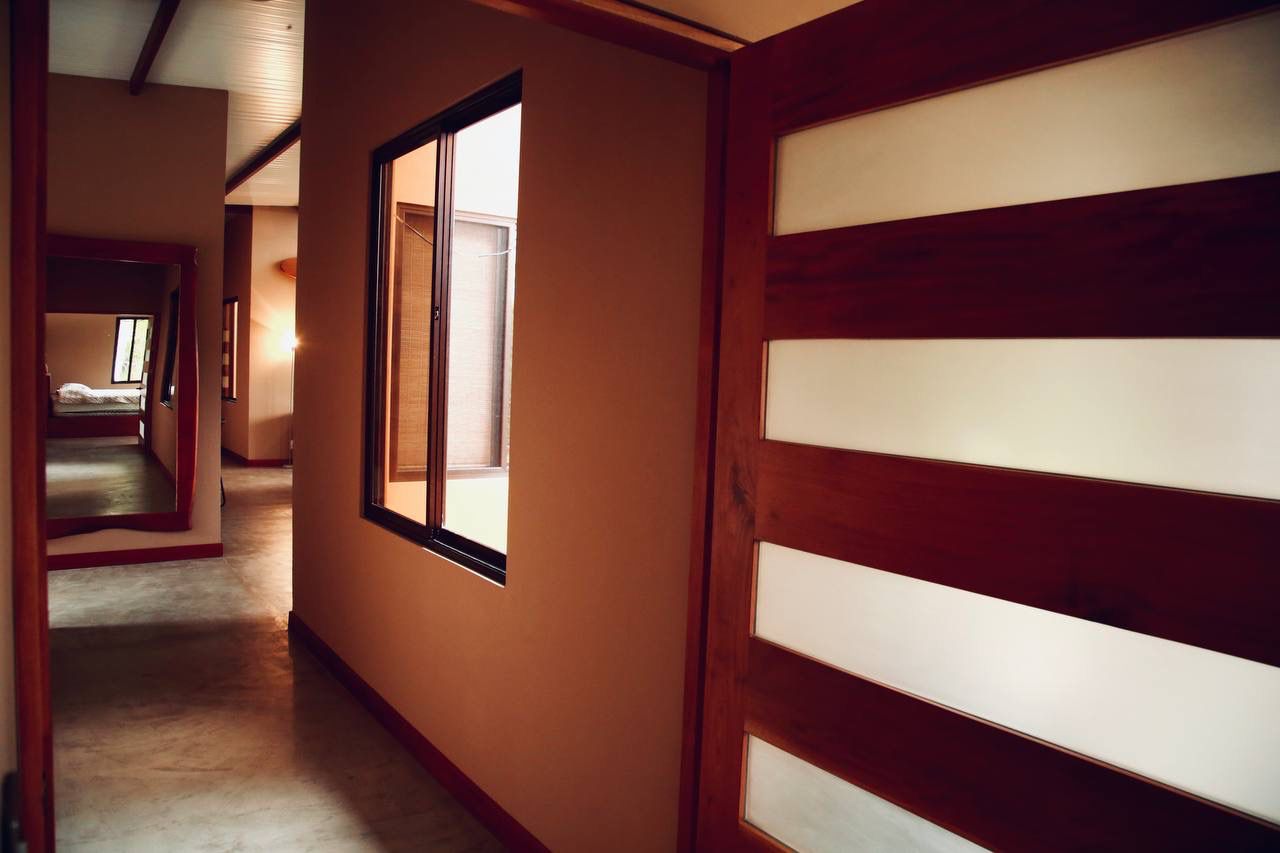 Hallway with modern wood and glass doors