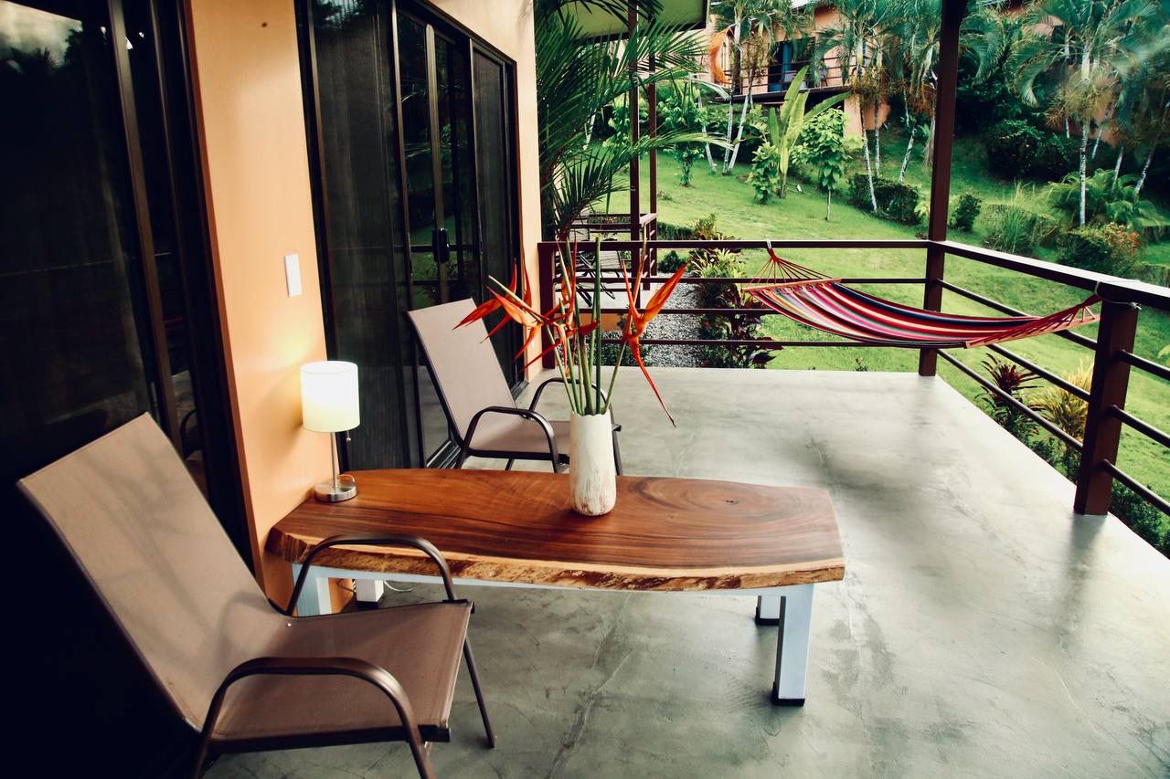 Terrace with live-edge wood table and hammock